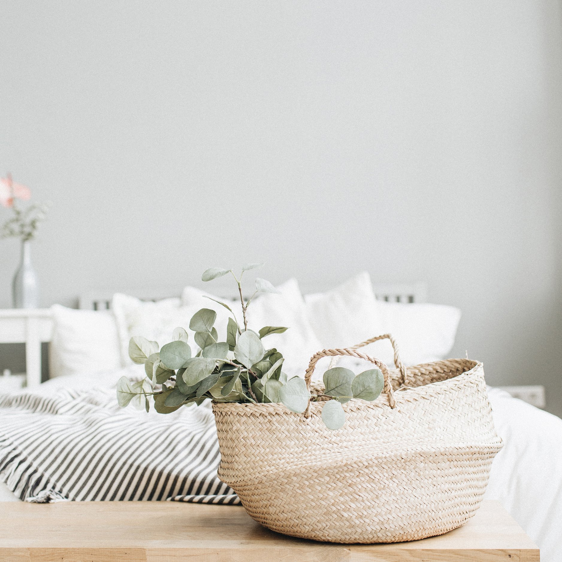 Bed and eucalyptus branch